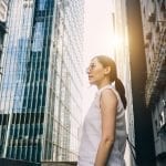 Lenovo brand image - woman standing alone surrounded by city skyscrapers