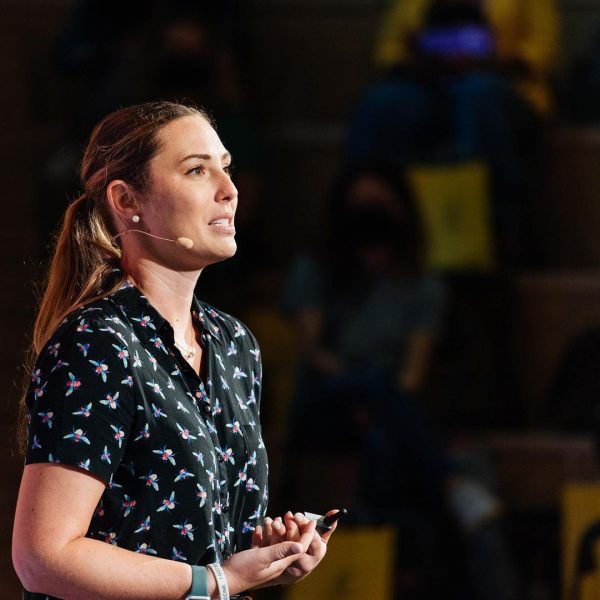 Leigh-Kathryn speaking to an audience in a conference